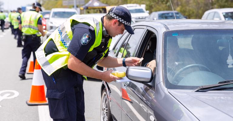 Police officers conducting roadside check representing law enforcement powers