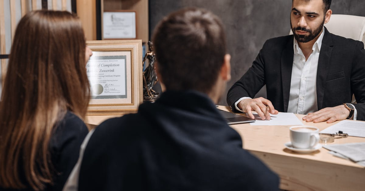Lawyer reviewing legal documents at desk for criminal bail application